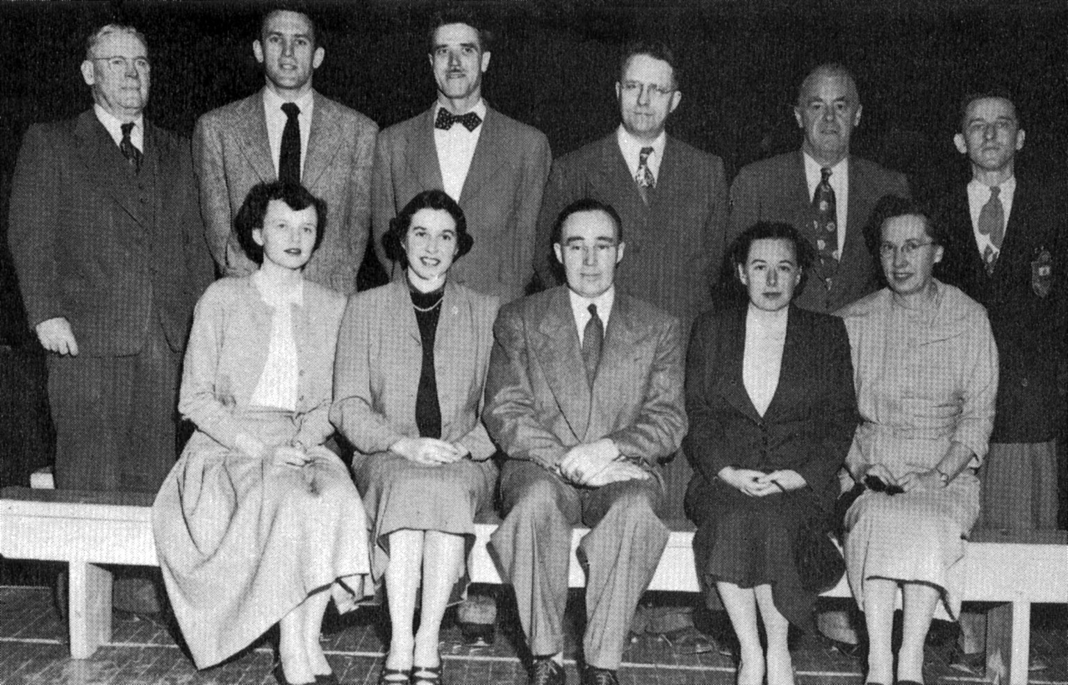 (Click to magnify - multiple levels of magnification) FRONT ROW: Miss Pearson, Miss Carnwith, Mr. Peter Bernhardt, Miss Thompson, Miss McQuade; BACK ROW: Mr. Barnhardt, Mr. Bob Rattray, Mr. Bert Law, Mr. Robinson, Mr. Crawford, Mr. Brooks.