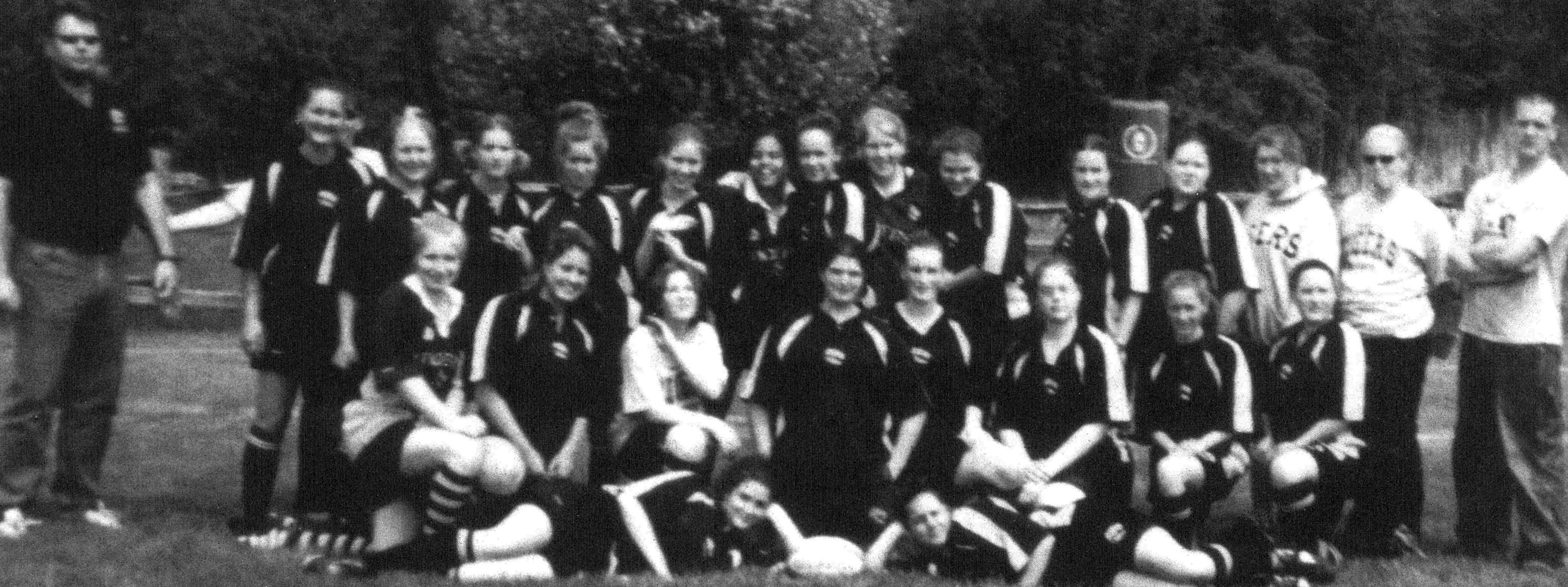 (Click to magnify - original is depressingly of poor quality; scanned in high resolution but that can't change the original low resolution photo) FRONT ROW: Meagan Yeadon, Lyndsay Huntley; SECOND ROW: Emily Bradford, Rebecca Lawes, Nikki Menzies, Sarah Bu
